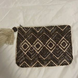 Gold beaded clutch with pom pom zipper. OBO